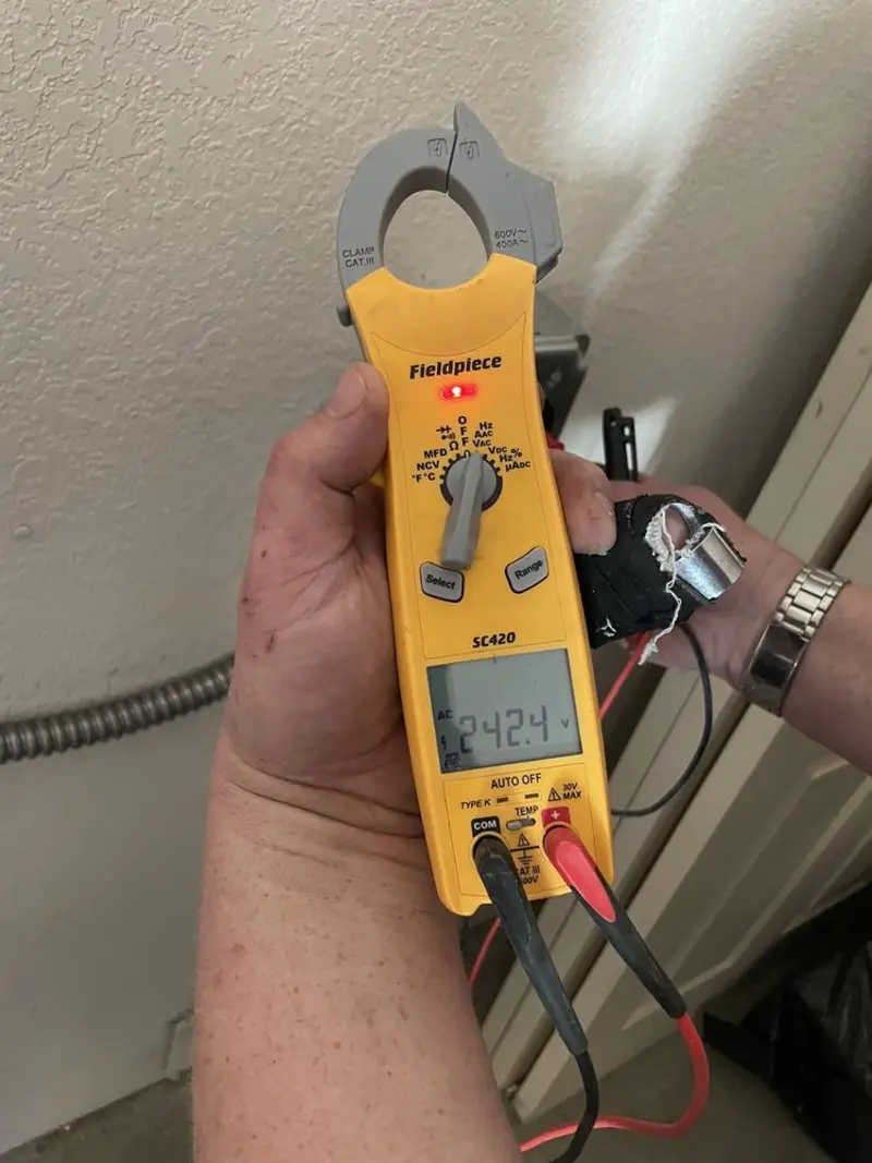 Voltage testing with clamp meter during Generator Installation in Denison